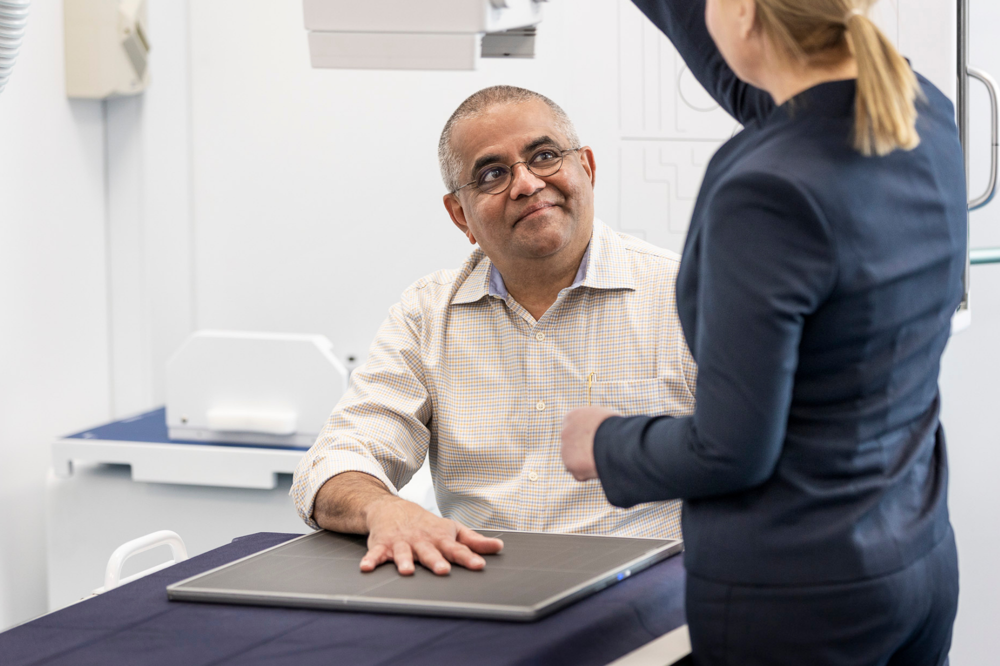 Specialist Doing an Arm Xray on Patient | Ultrasound Services Near Me | Fowler Simmons Radiology