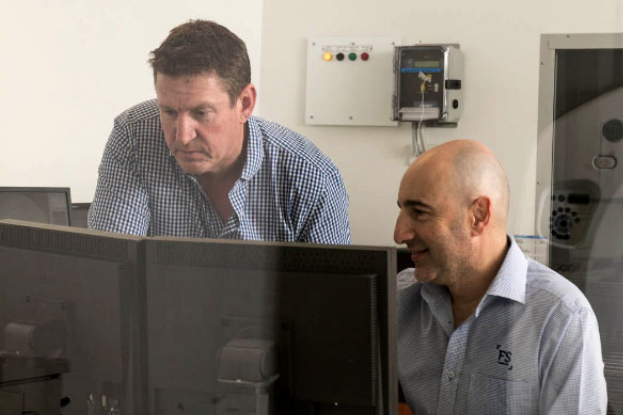 Two Professionals Studying Patient's Xray | Interventional Radiology | Fowler Simmons Radiology